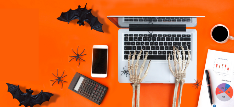 Skeleton typing on a laptop.