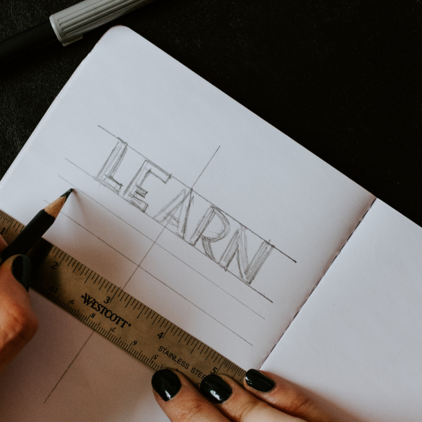 "LEARN" written on a piece of paper.