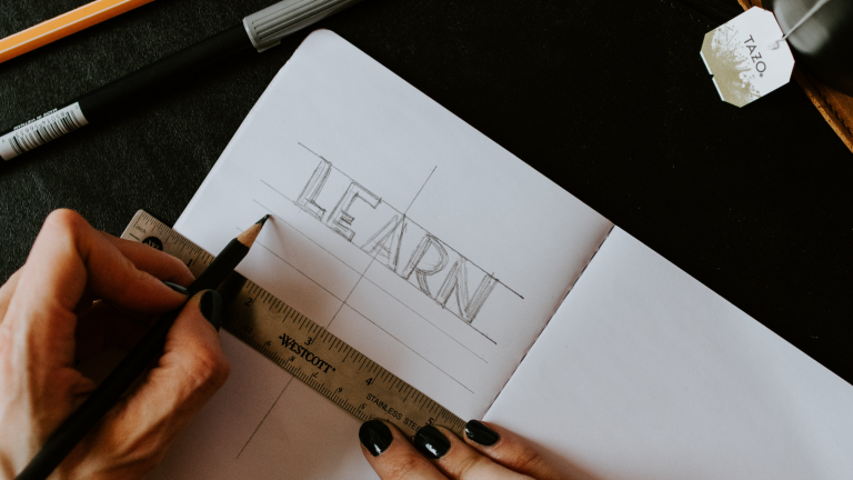 "LEARN" written on a piece of paper.
